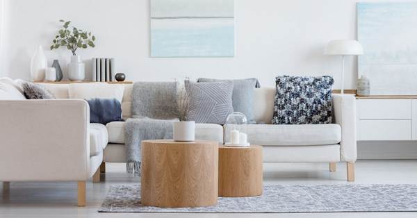 White tone modern sofa with two round coffee tables